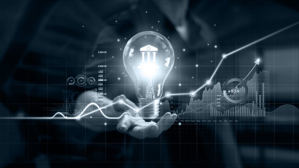 Pessoa com a mão esticada, uma lâmpada flutuando sobre ela e gráficos na tela.